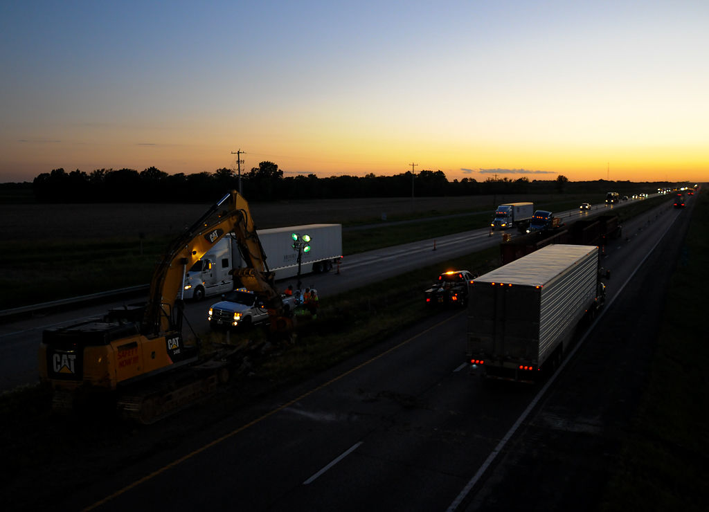 Vehicles pass through the interstate before it was closed for a bridge demolition